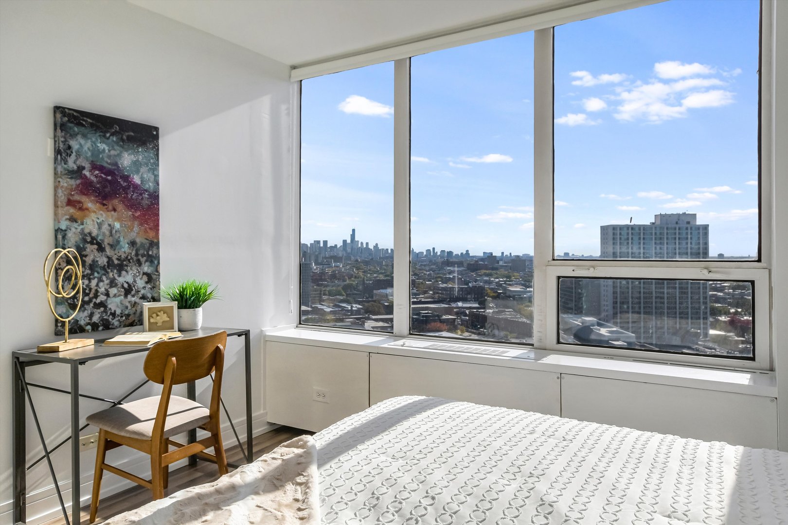3930 North Pine Grove Avenue, Unit 2308 Chicago, IL 60613 - Photo 13 of 29 a bedroom with a bed and large window with outer view