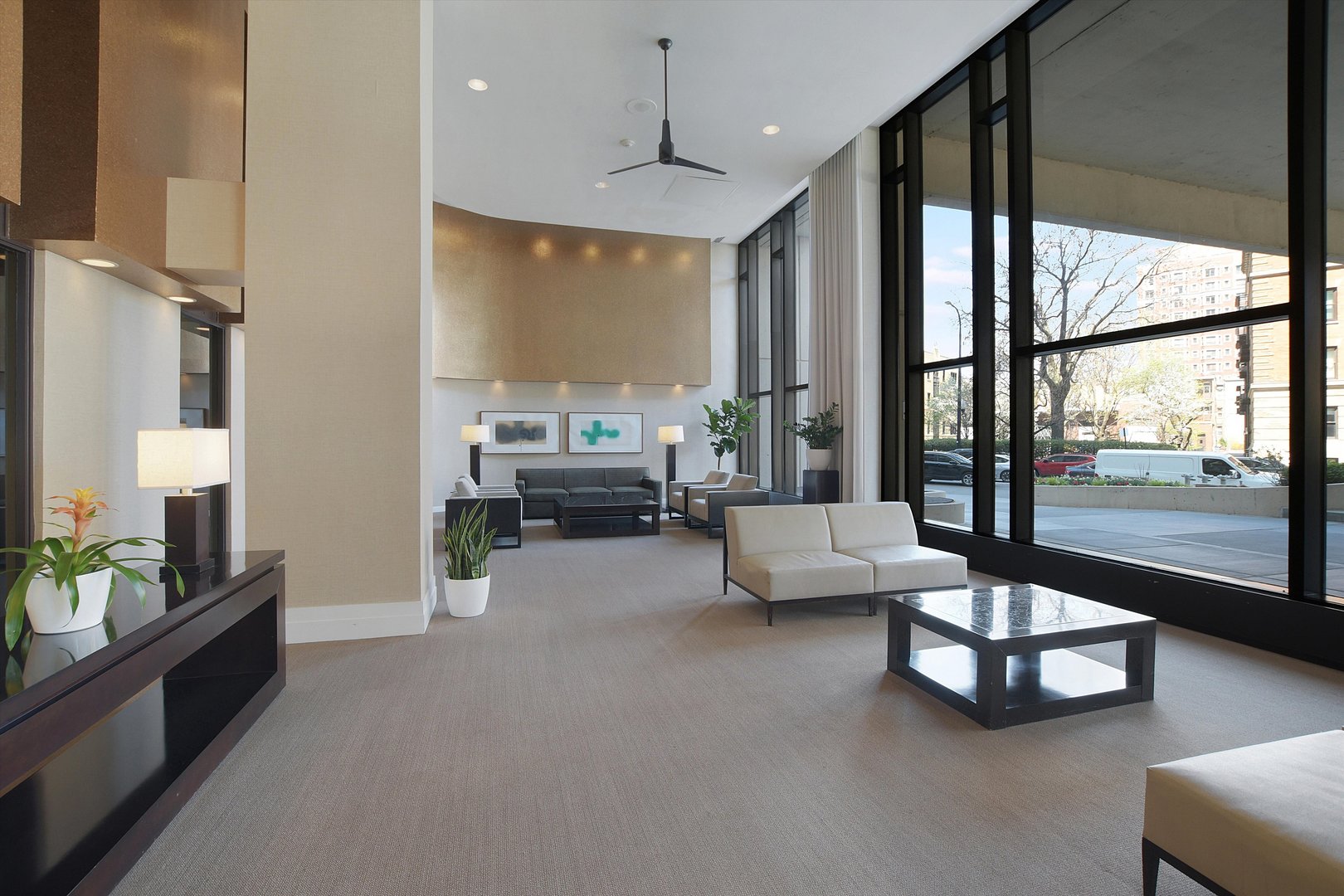 3930 North Pine Grove Avenue, Unit 2308 Chicago, IL 60613 - Photo 2 of 29 a living room with furniture and a large window