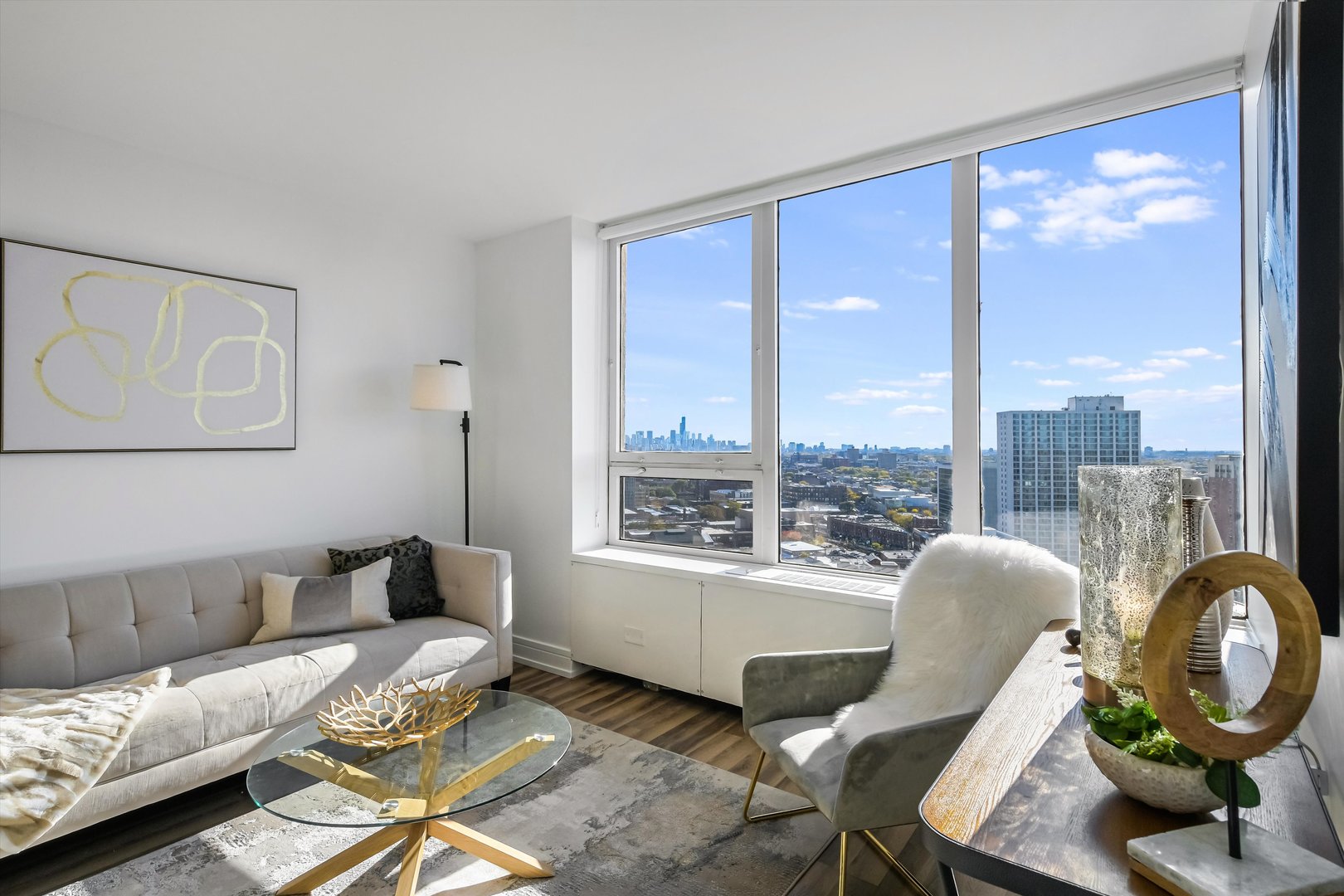 3930 North Pine Grove Avenue, Unit 2308 Chicago, IL 60613 - Photo 5 of 29 a living room with furniture and a large window
