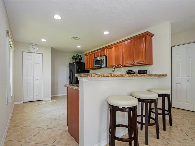 a view of walk in closet with clothes