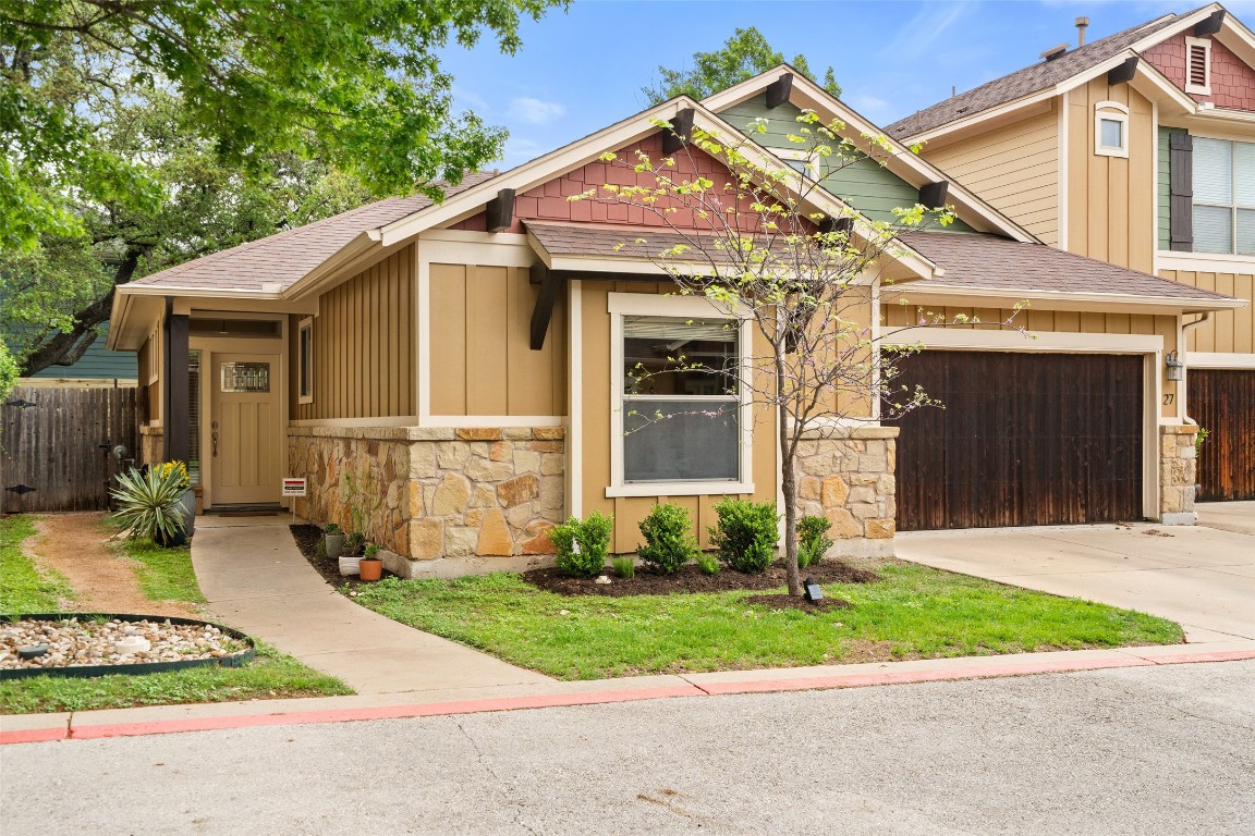 front view of a house with a small yard