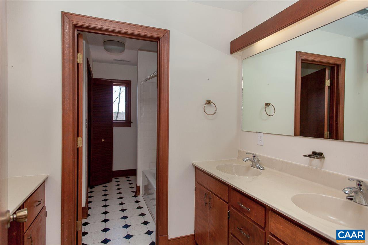 5331 Louisa Road Keswick, VA 22947 - Photo 23 of 49 a bathroom with a sink a vanity and a mirror