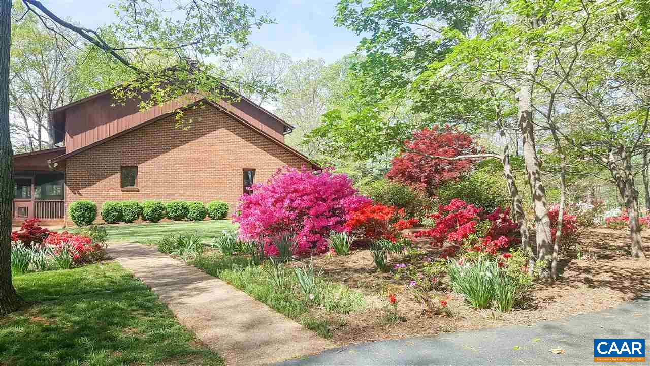 5331 Louisa Road Keswick, VA 22947 - Photo 4 of 49 a view of a wooden house with a yard