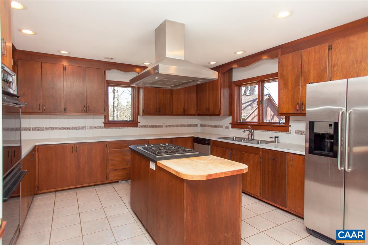 5331 Louisa Road Keswick, VA 22947 - Photo 8 of 49 a kitchen with stainless steel appliances granite countertop a sink stove and refrigerator