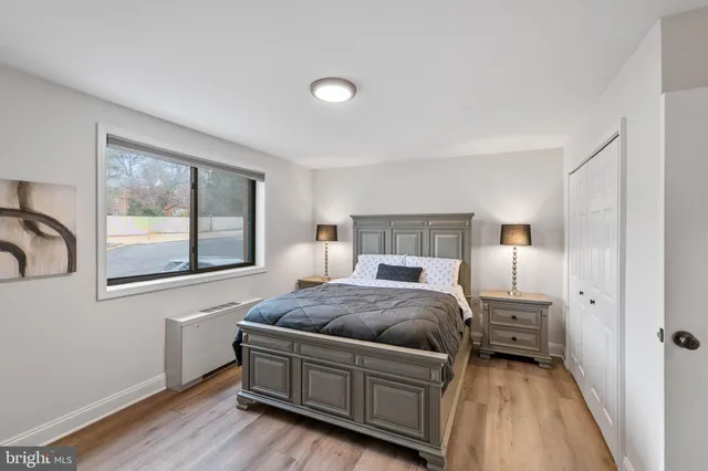 a bedroom with a bed and window