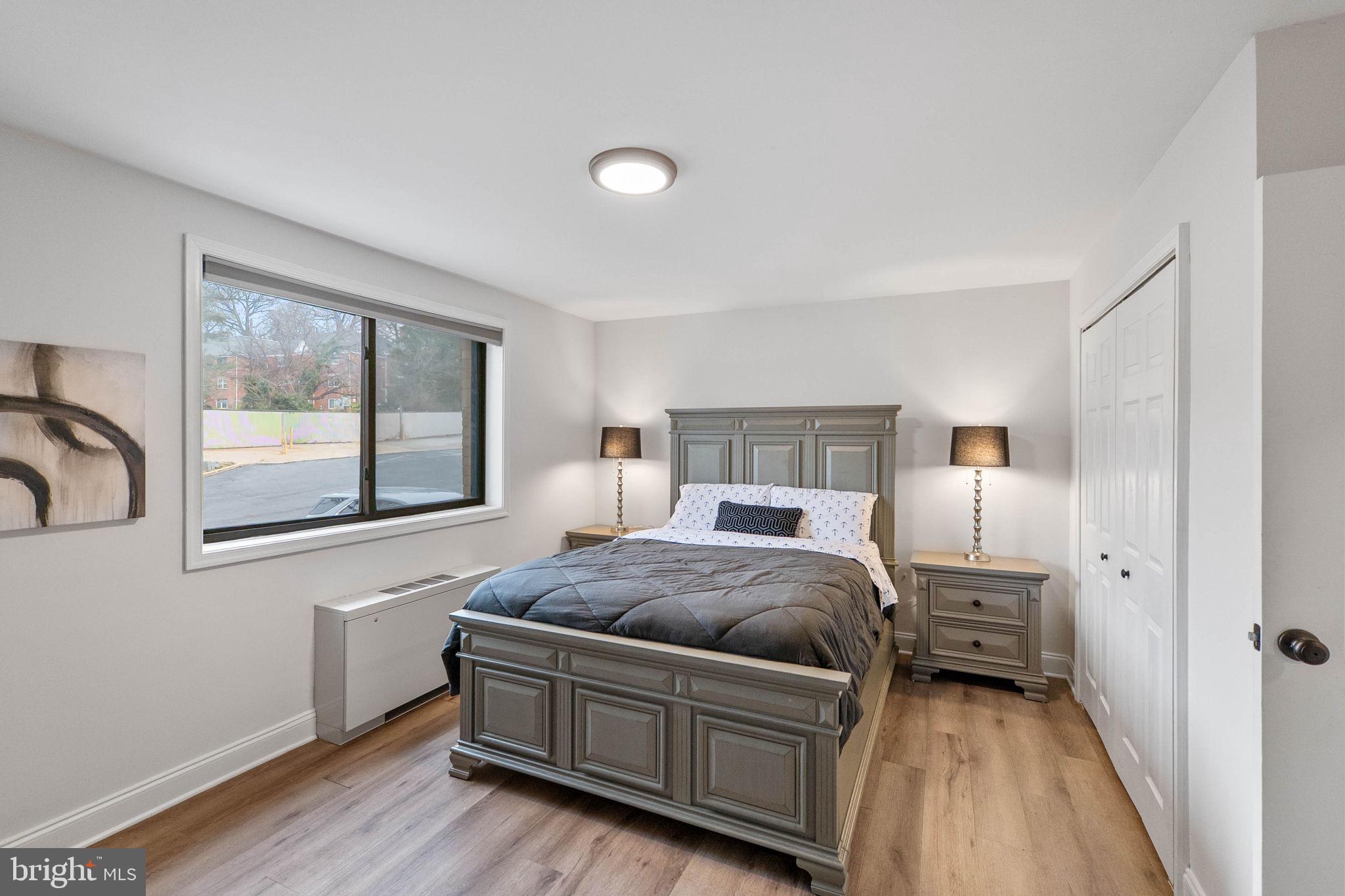 8601 Manchester Road, Unit 220 Silver Spring, MD 20901 - Photo 19 of 27 a bedroom with a bed and window