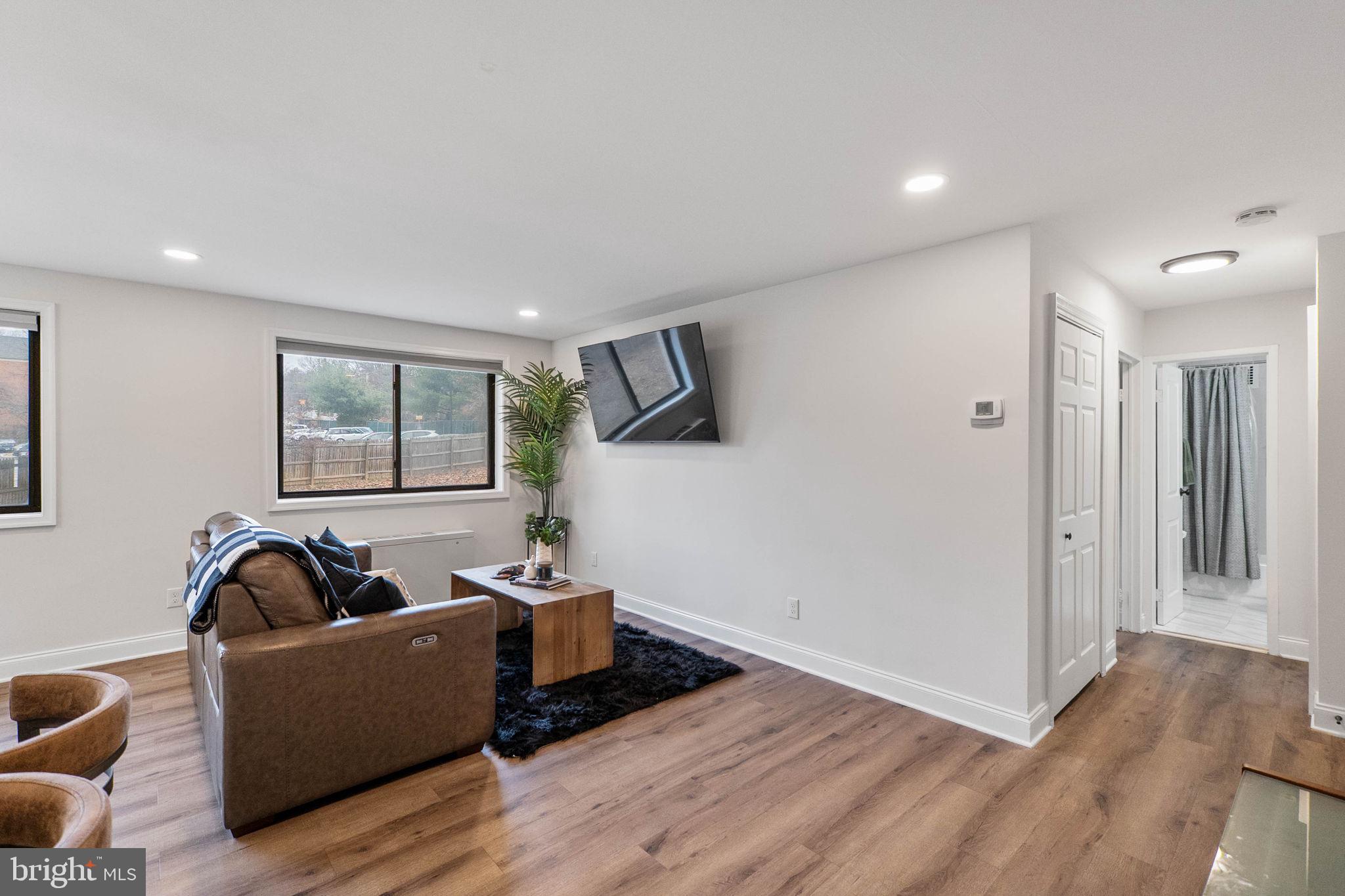 8601 Manchester Road, Unit 220 Silver Spring, MD 20901 - Photo 2 of 27 a living room with furniture and a window