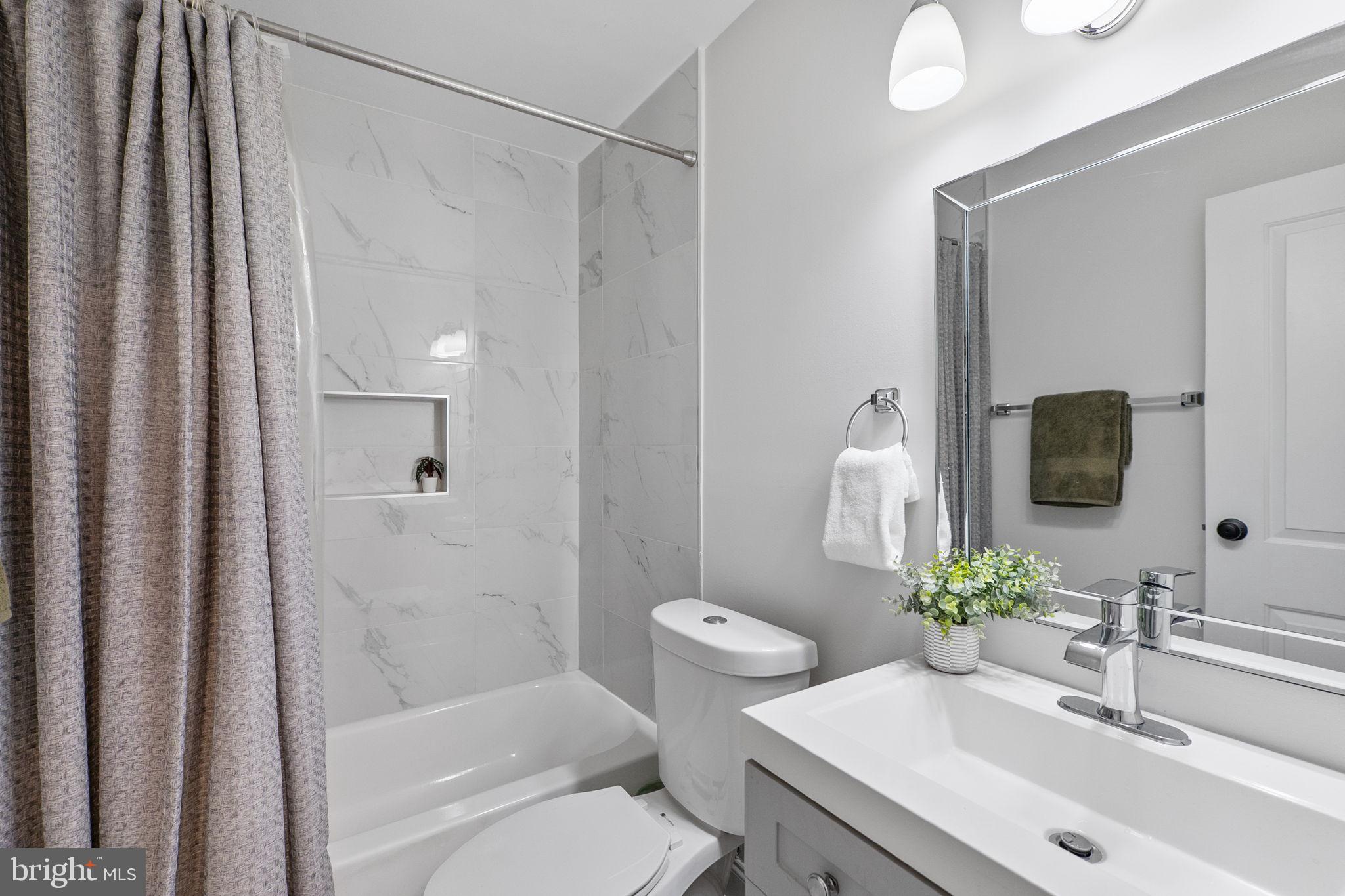 8601 Manchester Road, Unit 220 Silver Spring, MD 20901 - Photo 22 of 27 a bathroom with a sink toilet and shower