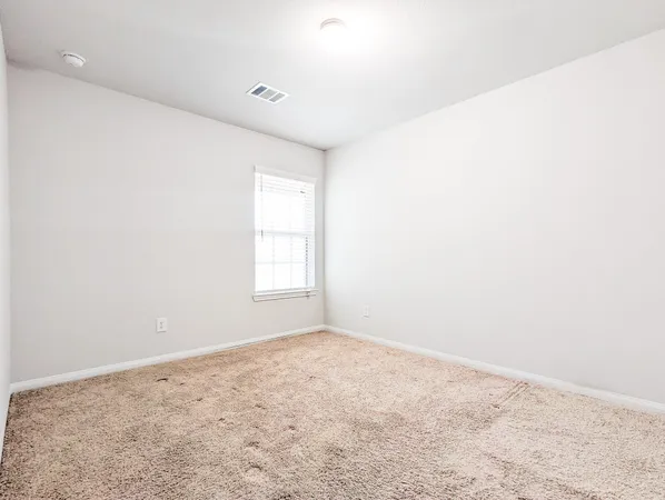 an empty room with a natural light