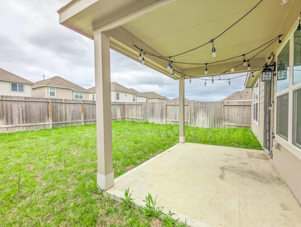 a view of a back yard with a big yard