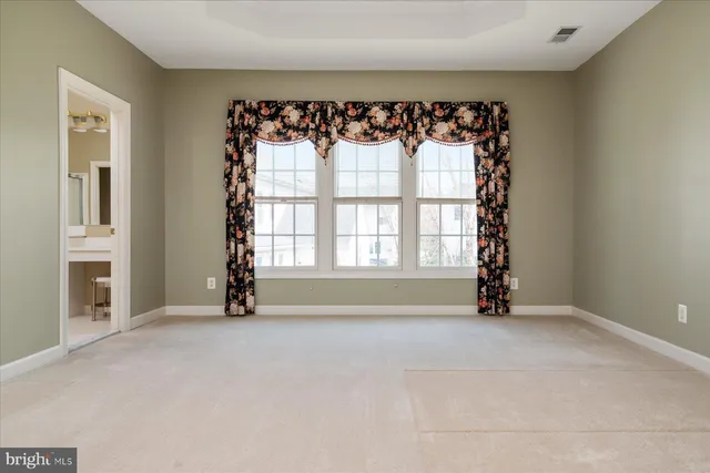 a bathroom with a bathtub and window