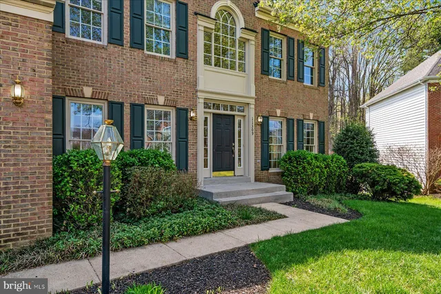 a bathroom with a sink mirror and toilet