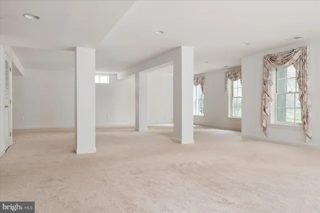 a view of empty room with windows