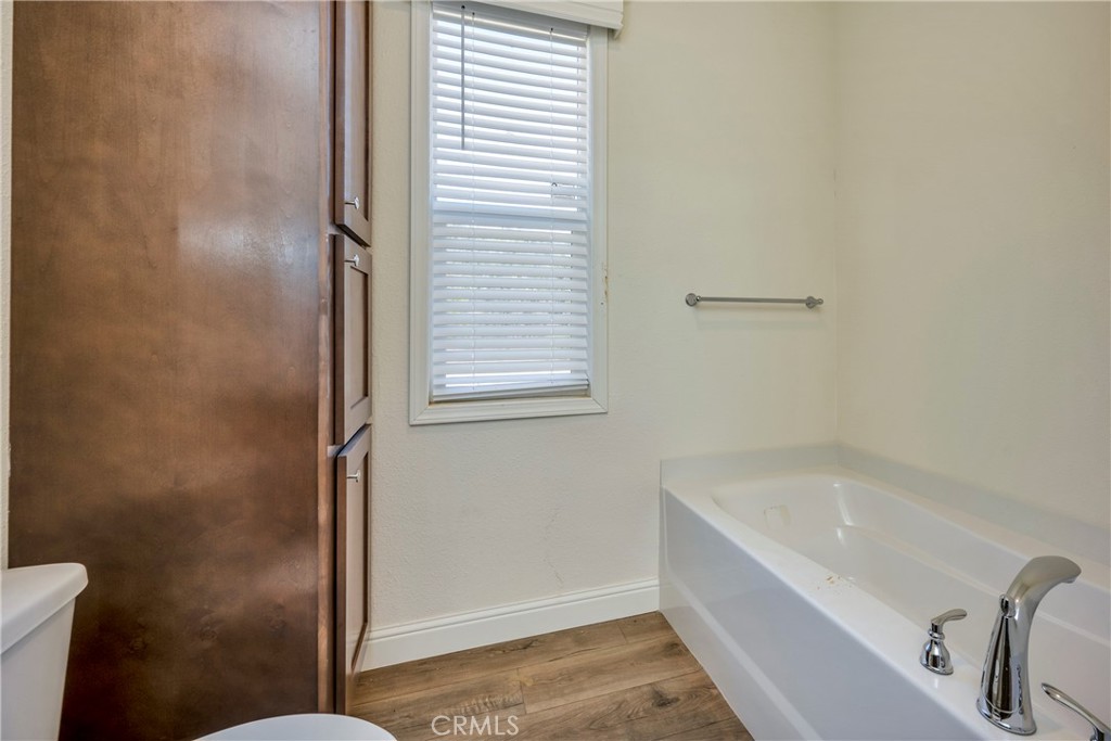 12299 Elk Mountain Road Upper Lake, CA 95485 - Photo 15 of 37 a bathroom with a bathtub and a window