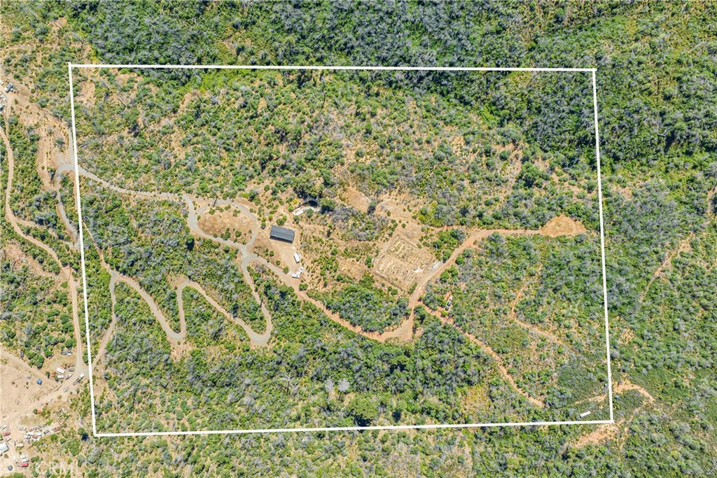 12299 Elk Mountain Road Upper Lake, CA 95485 - Photo 18 of 37 a bathroom with a shower curtain and a sink