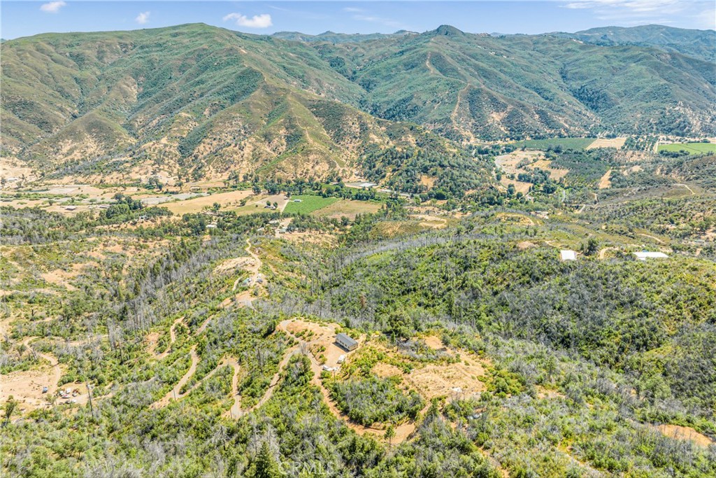 12299 Elk Mountain Road Upper Lake, CA 95485 - Photo 21 of 37 a view of a field with mountains in the background