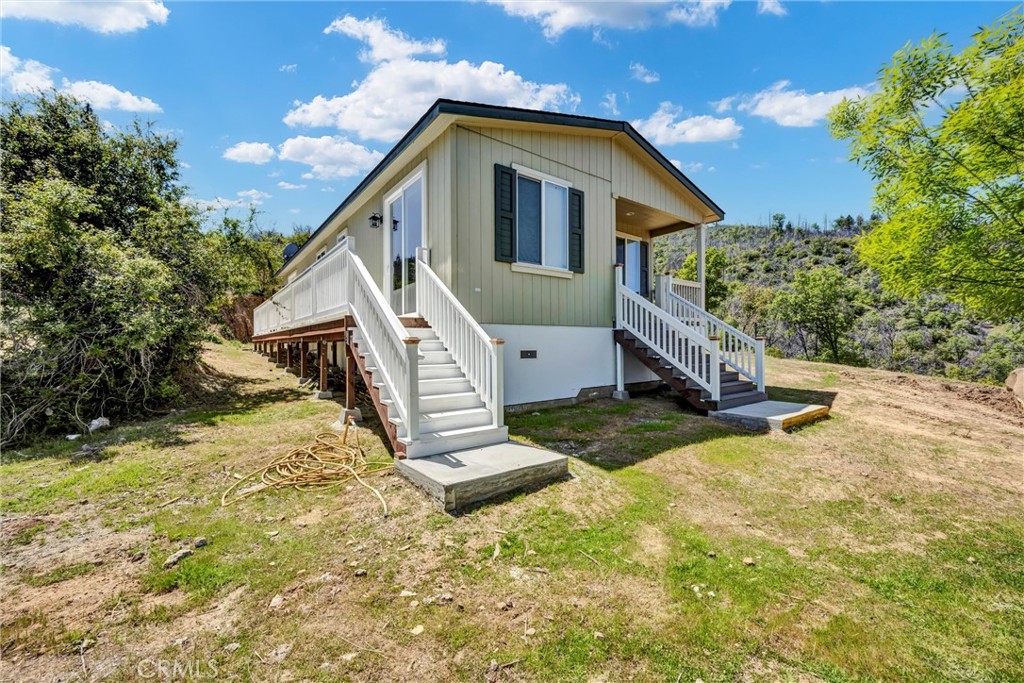 12299 Elk Mountain Road Upper Lake, CA 95485 - Photo 25 of 37 a view of a house with a yard