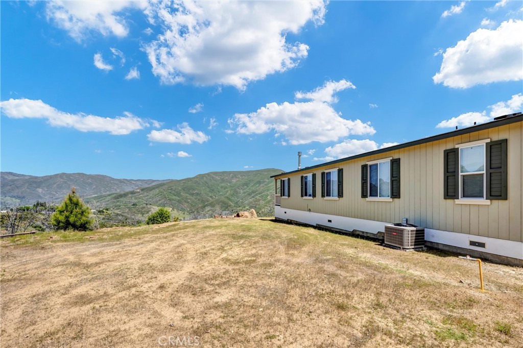 12299 Elk Mountain Road Upper Lake, CA 95485 - Photo 30 of 37 a view of a house with a yard