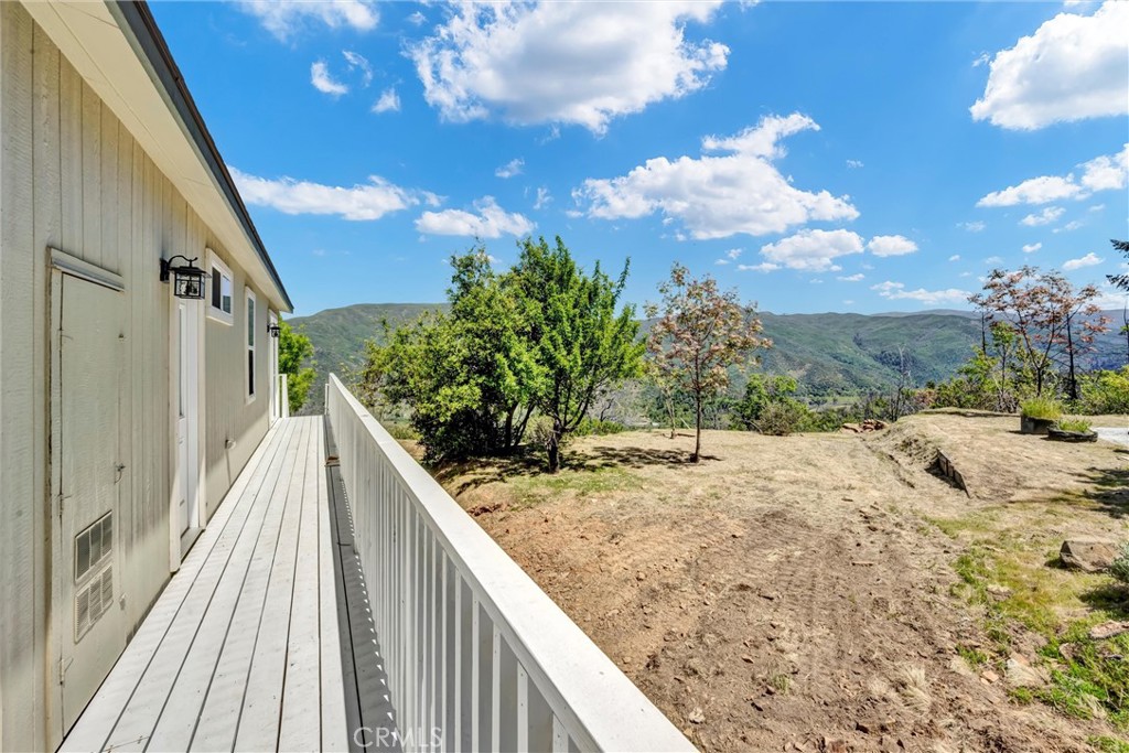 12299 Elk Mountain Road Upper Lake, CA 95485 - Photo 34 of 37 a view of balcony with wooden floor and fence