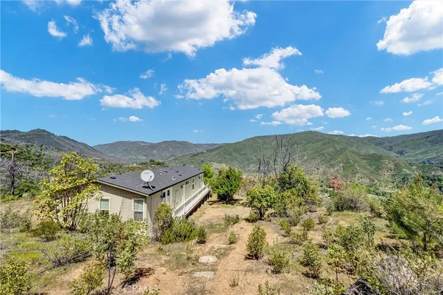 a view of a house with a mountain