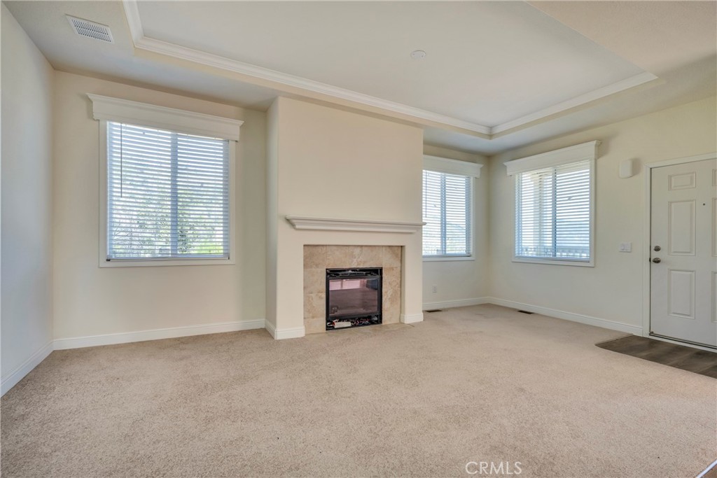 12299 Elk Mountain Road Upper Lake, CA 95485 - Photo 4 of 37 an empty room with windows and fireplace
