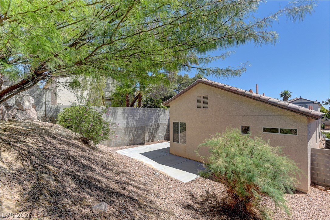 4613 Rising Cove Street Las Vegas, NV 89129 - Photo 19 of 20 This property features a private yard with a concrete patio, perfect for outdoor enjoyment.