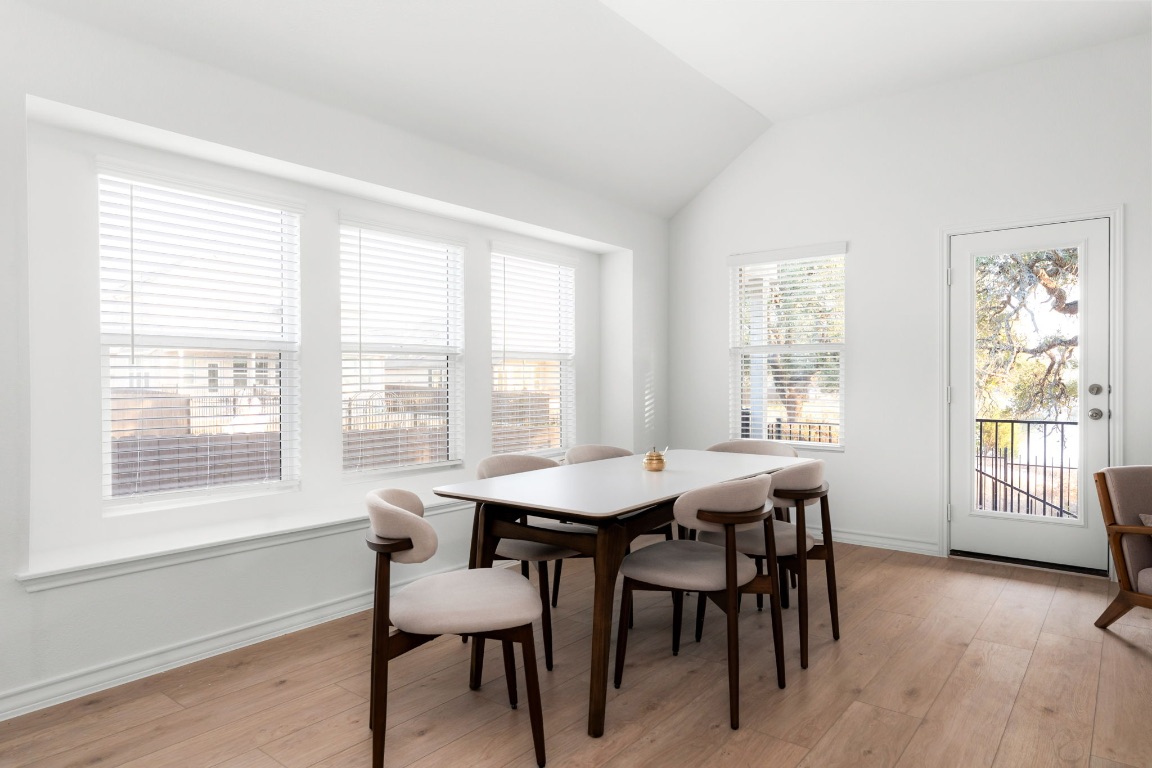 4264 Hill House Lane Georgetown, TX 78628 - Photo 11 of 30 Dining space with light wood-type flooring and lofted ceiling