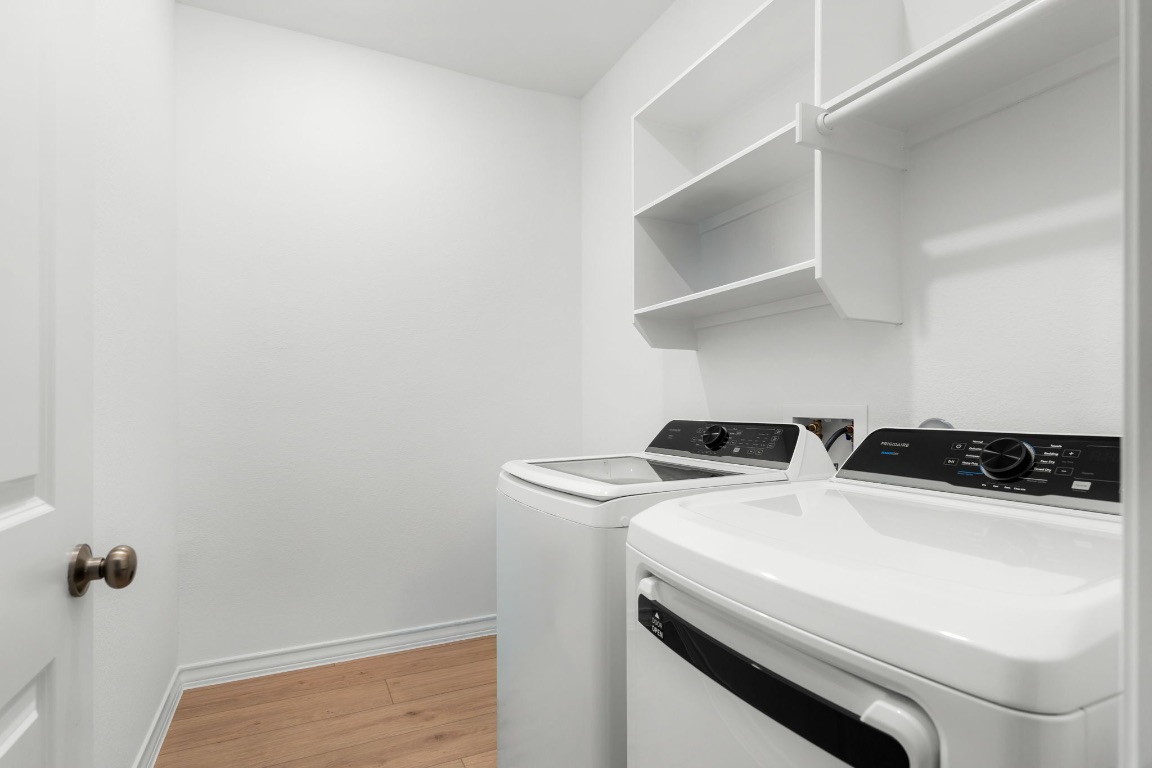 4264 Hill House Lane Georgetown, TX 78628 - Photo 26 of 30 Washroom with light wood finished floors and washer and dryer