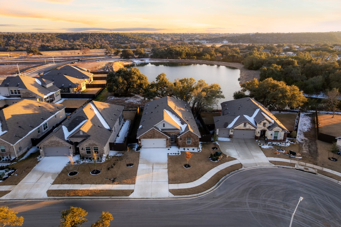 4264 Hill House Lane Georgetown, TX 78628 - Photo 29 of 30 Aerial view at dusk of a residential view and a water view