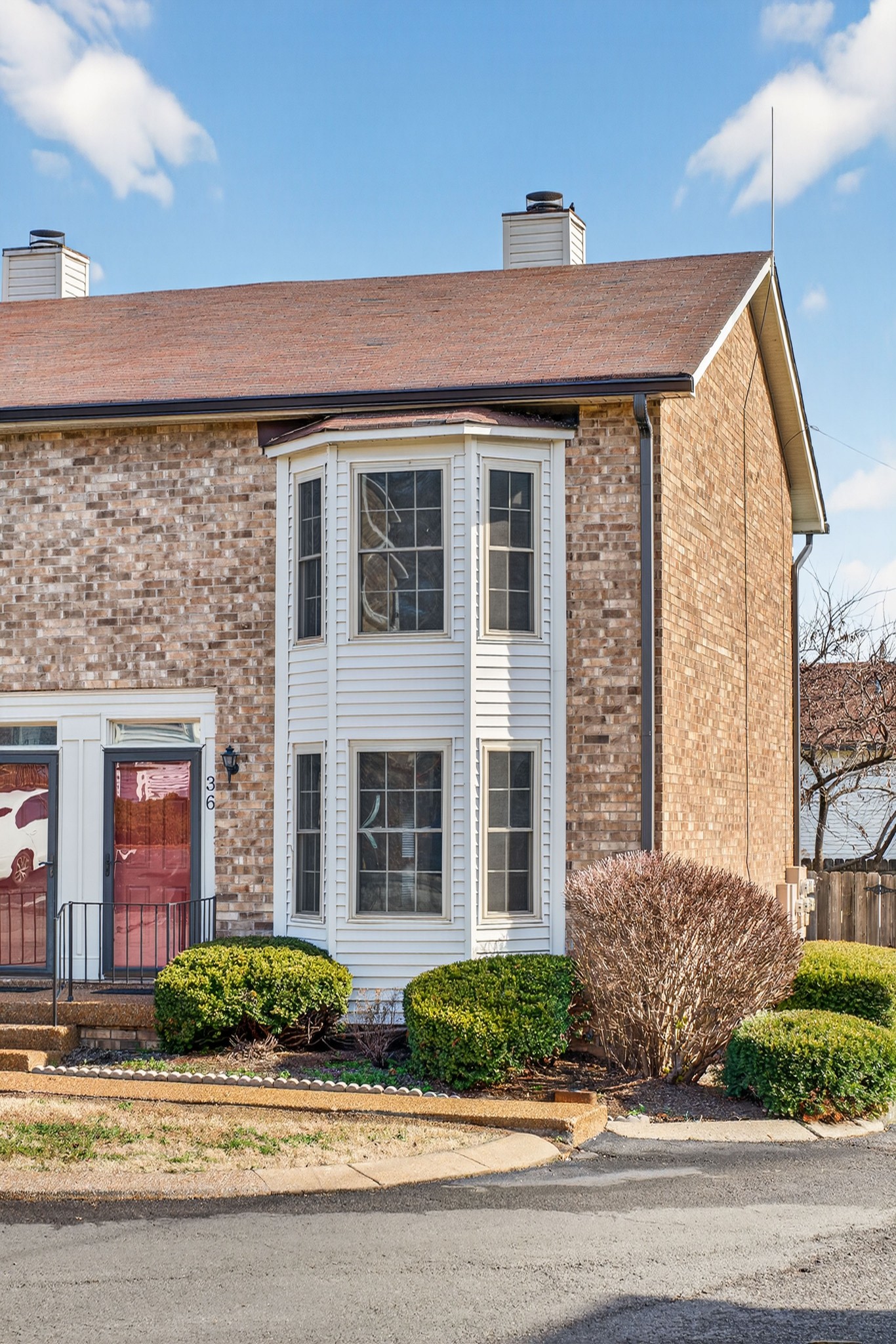 250 Sanders Ferry Road, Unit 36 Hendersonville, TN 37075 - Photo 1 of 92 a front view of a house with a garden