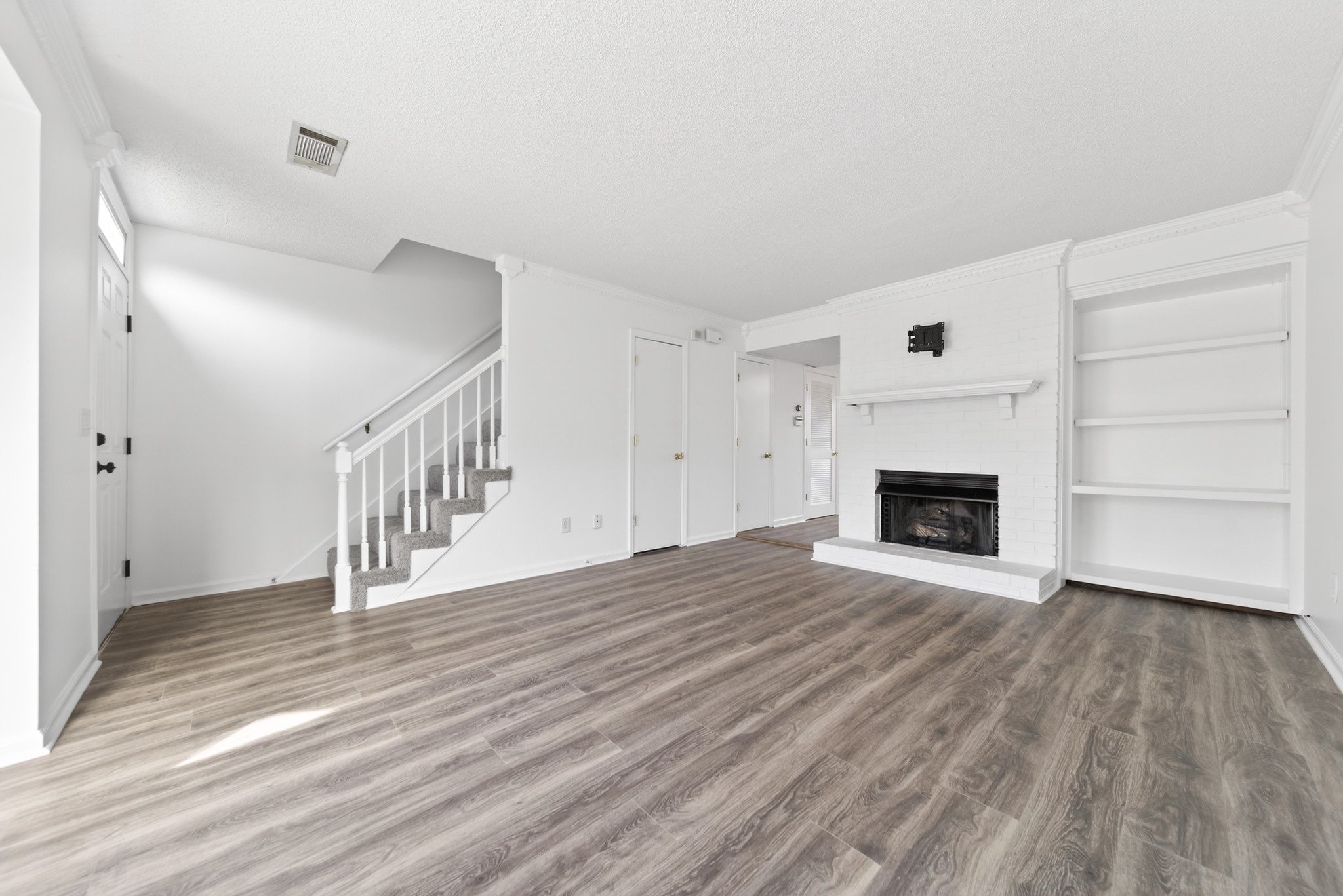 250 Sanders Ferry Road, Unit 36 Hendersonville, TN 37075 - Photo 16 of 92 a view of a livingroom with wooden floor and a fireplace