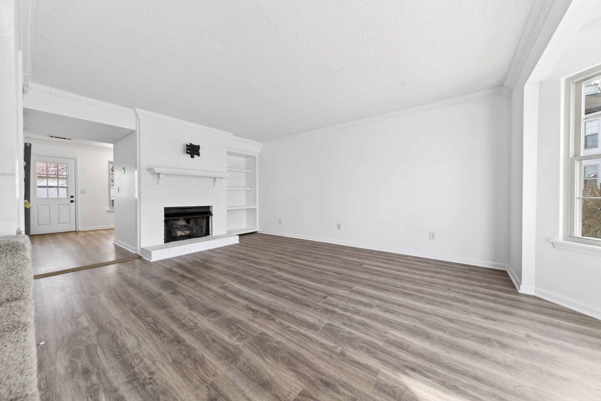 250 Sanders Ferry Road, Unit 36 Hendersonville, TN 37075 - Photo 18 of 92 a view of empty room with wooden floor and fireplace