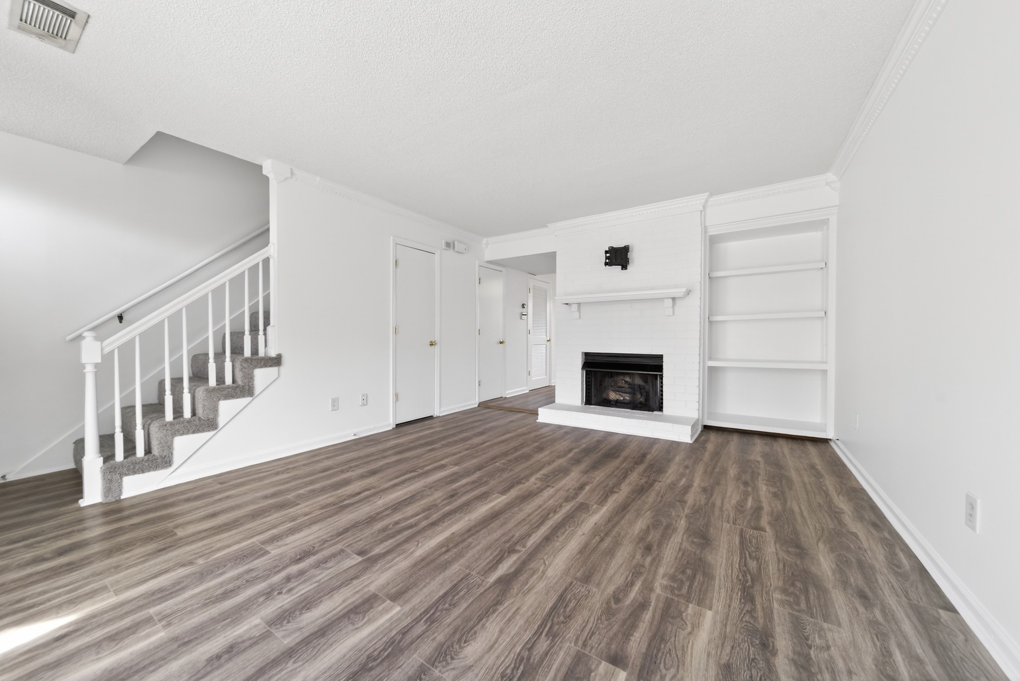 250 Sanders Ferry Road, Unit 36 Hendersonville, TN 37075 - Photo 19 of 92 a view of empty room with wooden floor and fireplace