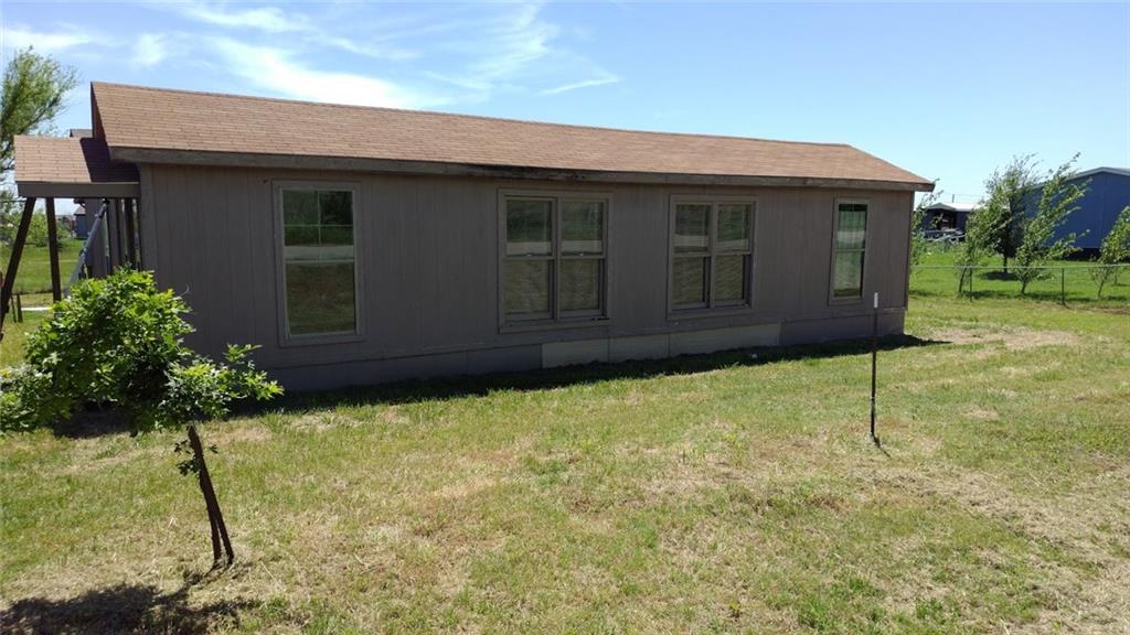 13077 George Foster Road Ponder, TX 76259 - Photo 1 of 1 a house with a yard