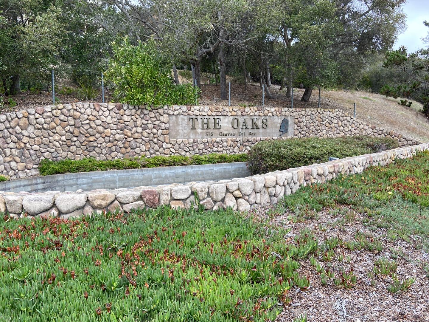710 Pheasant Ridge Road Del Rey Oaks, CA 93940 - Photo 1 of 35 a view of a garden with a bench