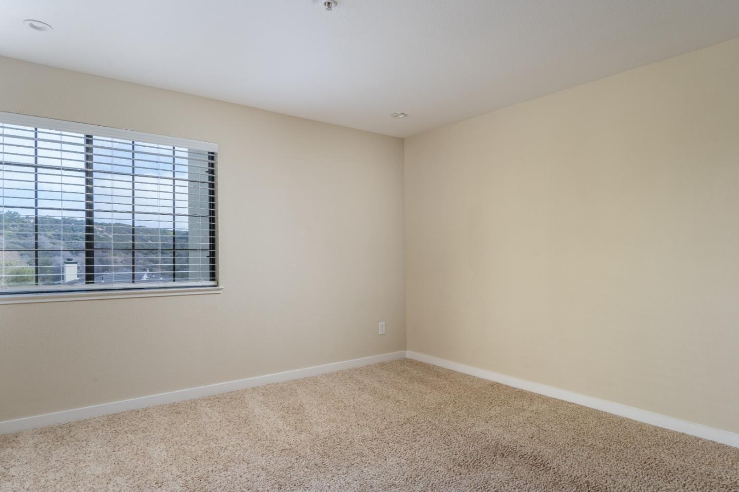 710 Pheasant Ridge Road Del Rey Oaks, CA 93940 - Photo 15 of 35 an empty room with a window