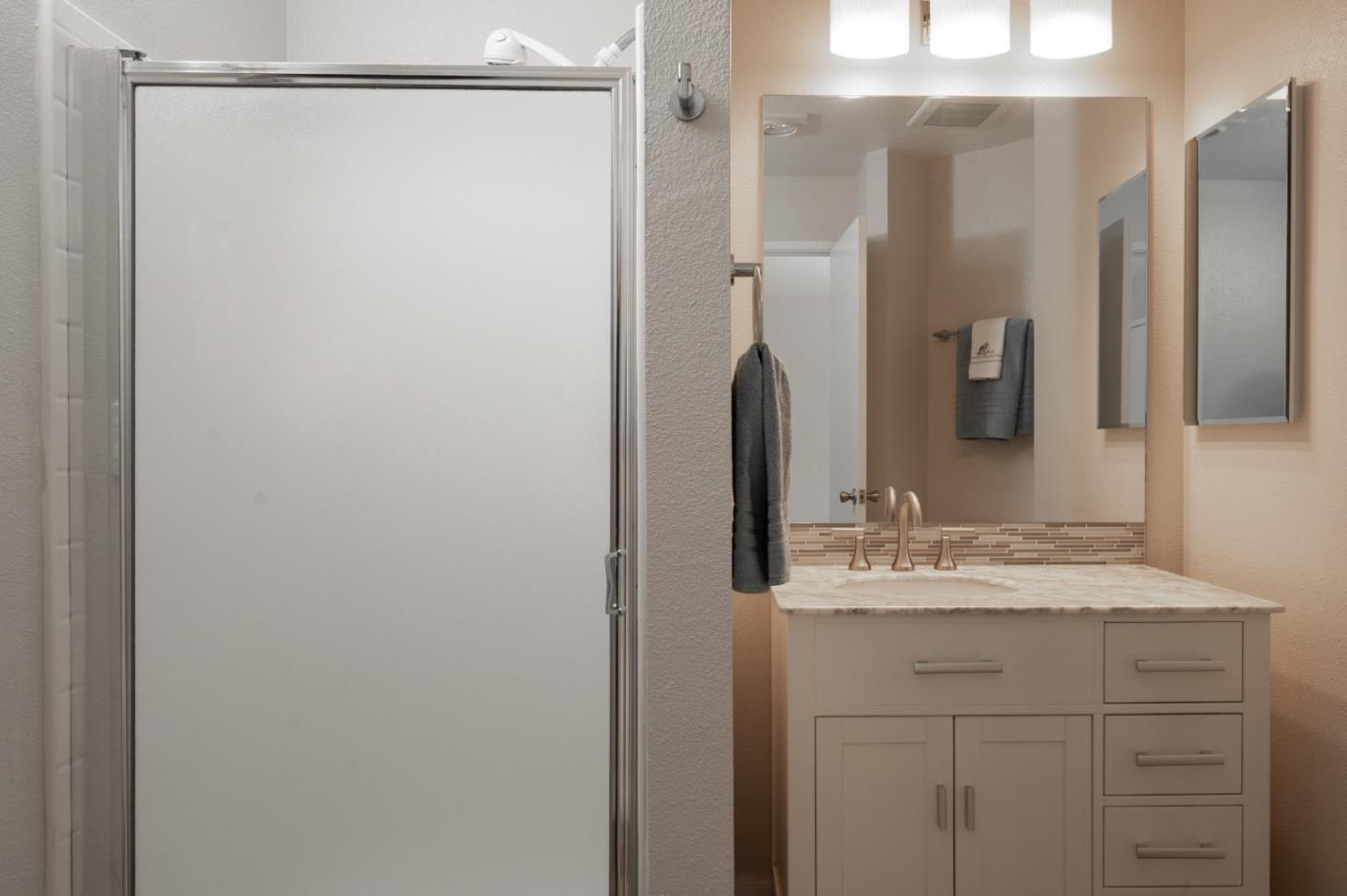 710 Pheasant Ridge Road Del Rey Oaks, CA 93940 - Photo 21 of 35 a bathroom with a sink and a mirror