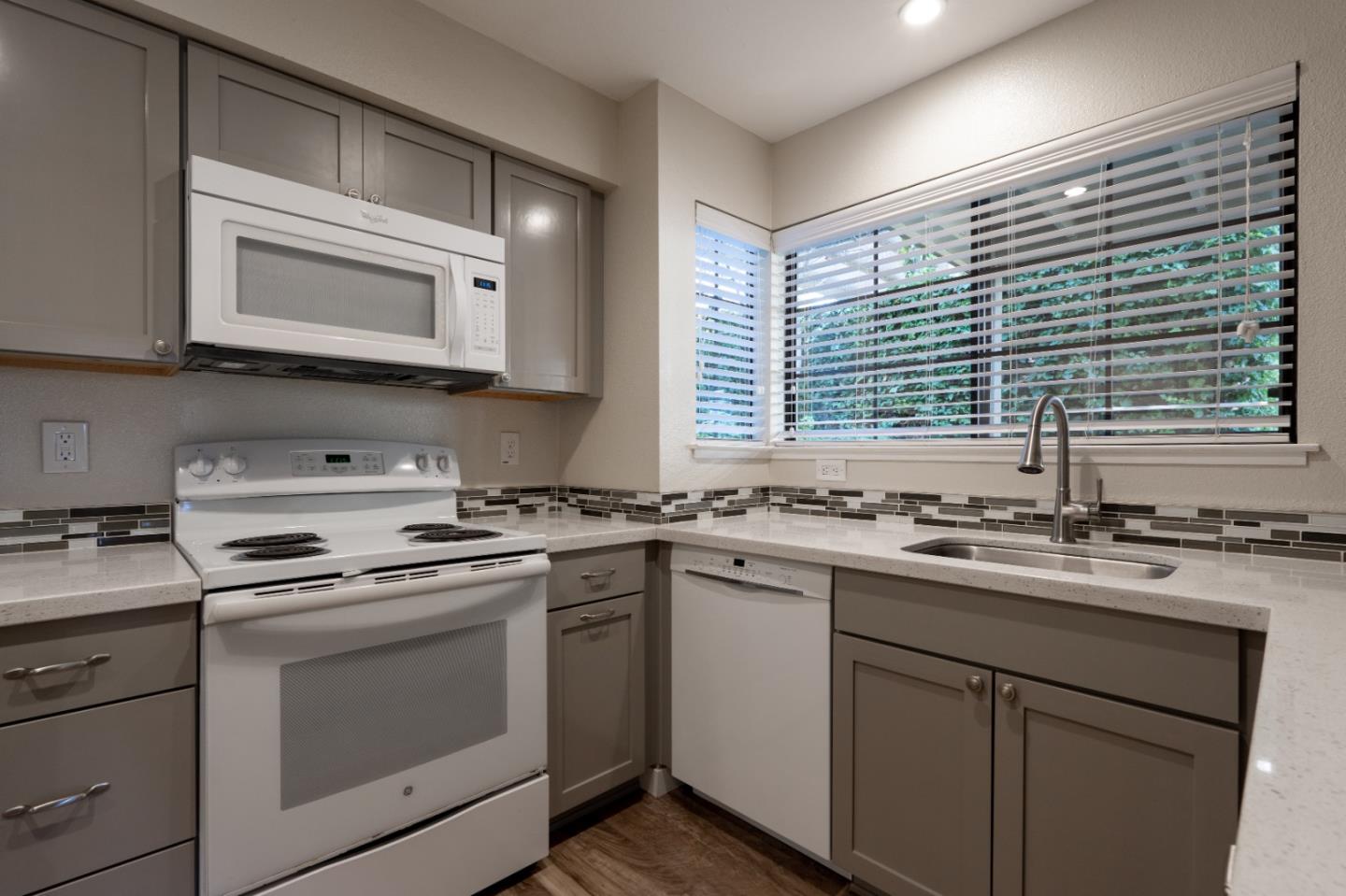 710 Pheasant Ridge Road Del Rey Oaks, CA 93940 - Photo 4 of 35 a kitchen with a sink stove top oven and microwave