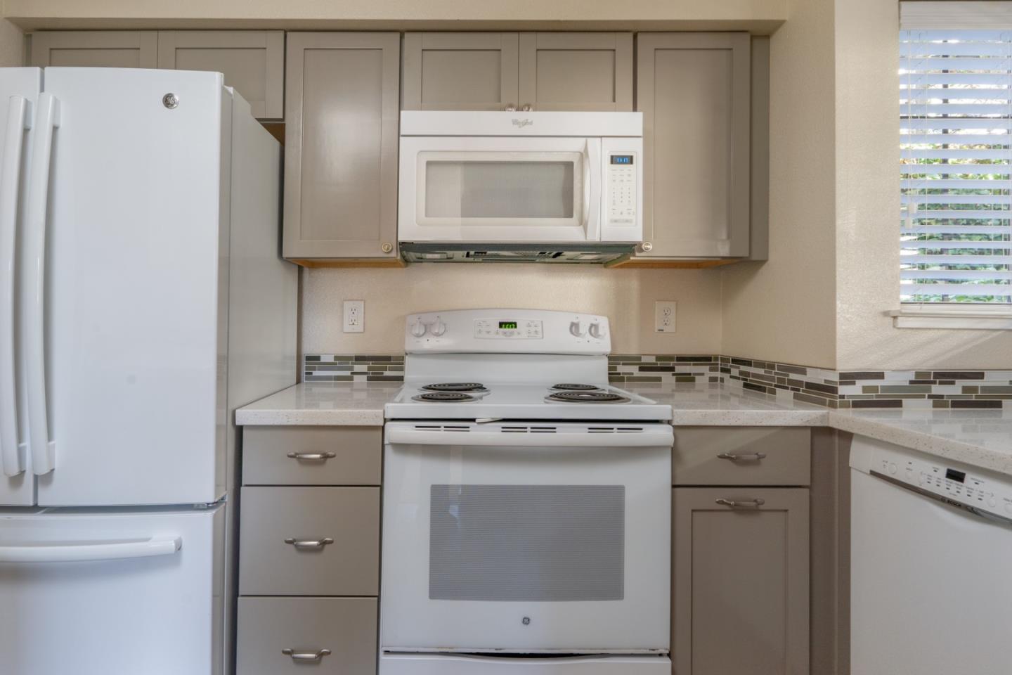 710 Pheasant Ridge Road Del Rey Oaks, CA 93940 - Photo 5 of 35 a kitchen with cabinets appliances a sink and a stove