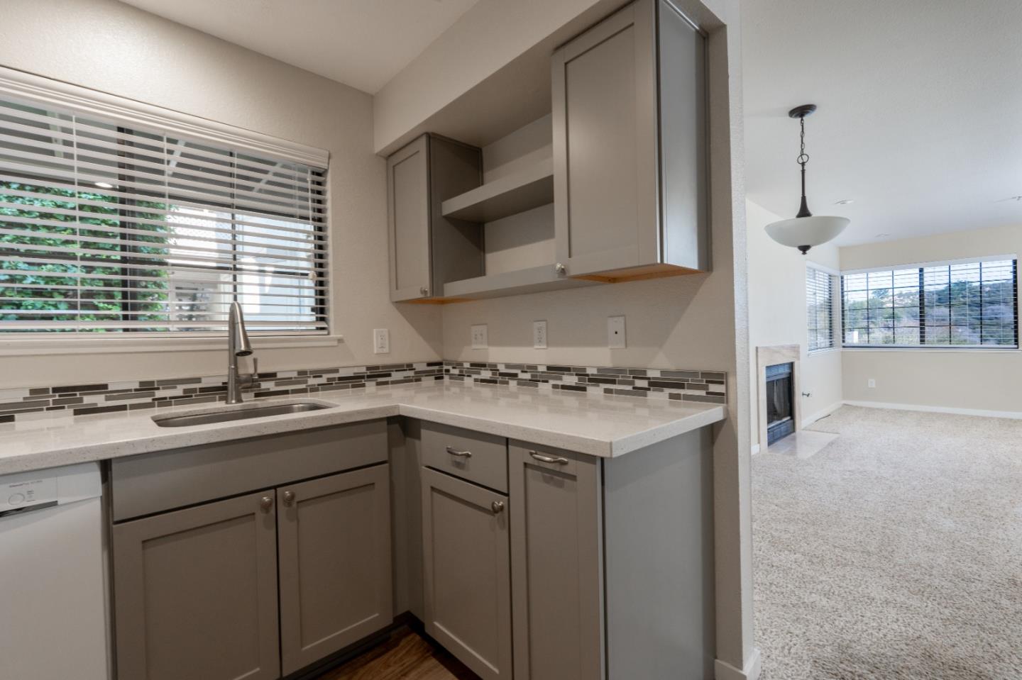 710 Pheasant Ridge Road Del Rey Oaks, CA 93940 - Photo 7 of 35 a kitchen with a sink stove and cabinets