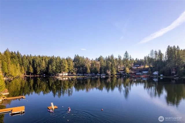a view of a lush green hillside and a building