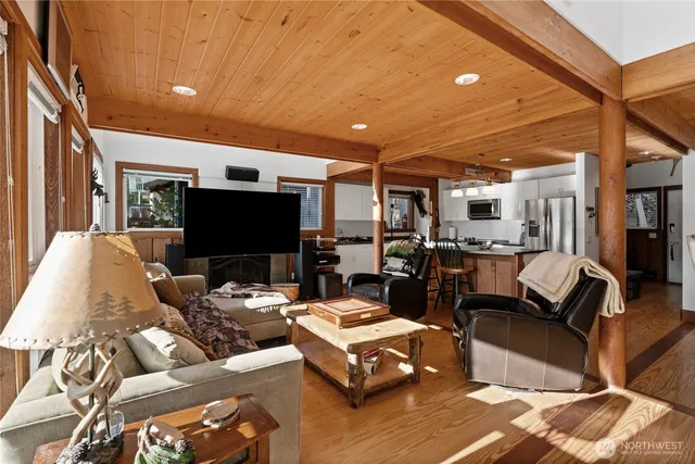 a bedroom with furniture and a large window