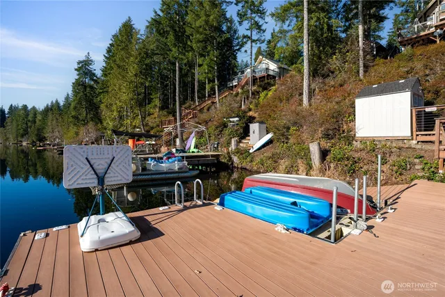an aerial view of a house with swimming pool garden and patio