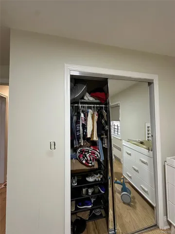 a hallway with a view of living room