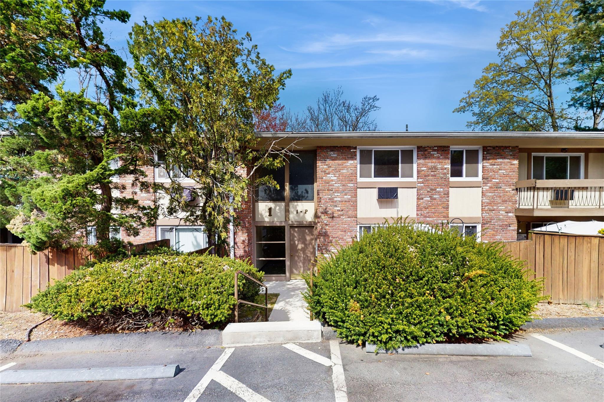 front view of a house with a garden