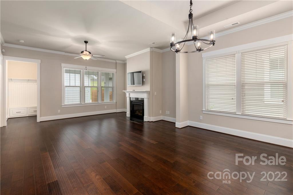 807 Digby Road, Unit 227 Rock Hill, SC 29730 - Photo 19 of 36 an empty room with wooden floor and windows