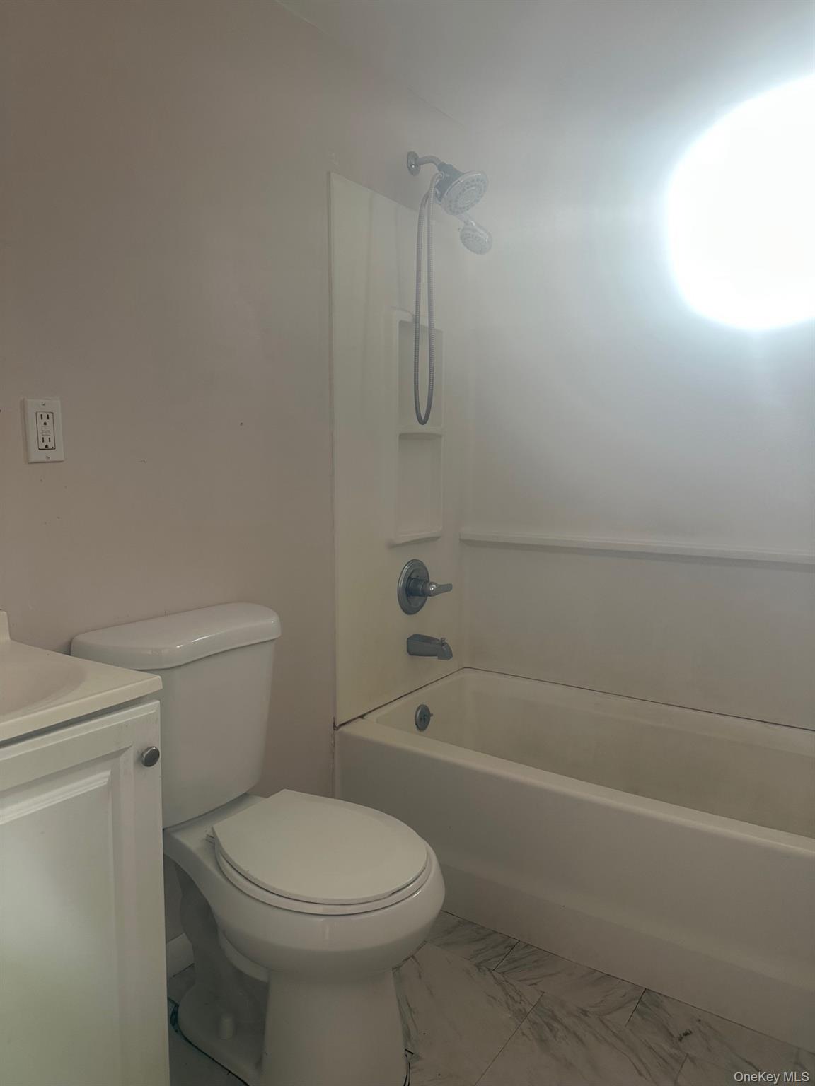 300 Ketchamtown Road, Unit C1 Wappingers Falls, NY 12590 - Photo 4 of 9 a bathroom with a toilet and a bath tub