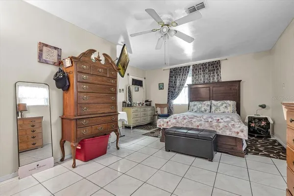 a close view of walk in closet with clothes