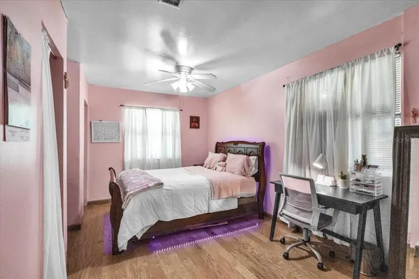 a bedroom with a bed and a dresser