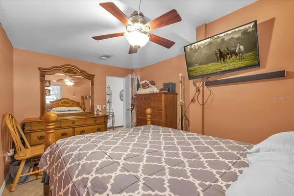 a view of a house with yard and sitting area